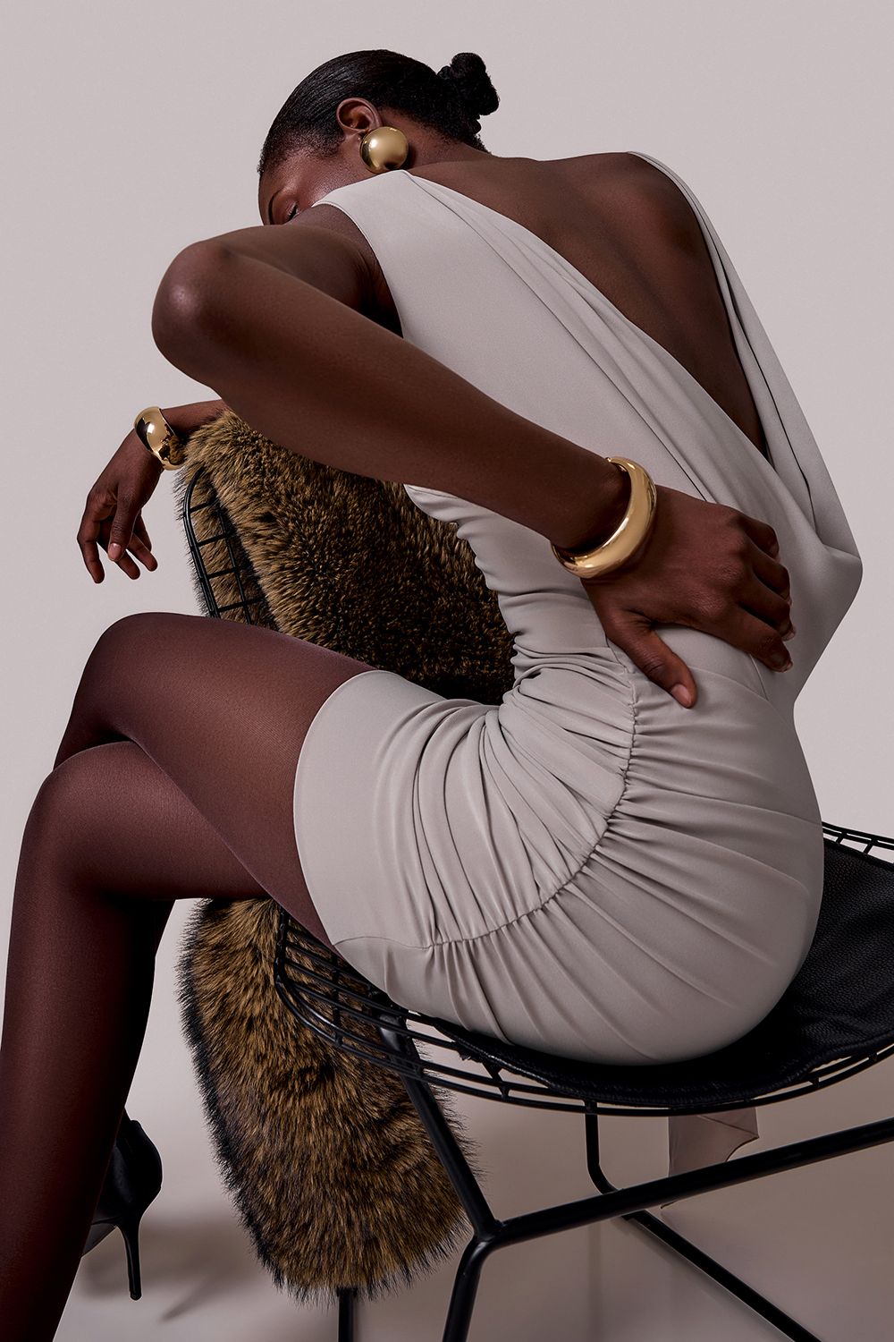 Mini dress with drapery and accent shoulder