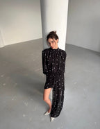Dress with drapery and voluminous shoulders